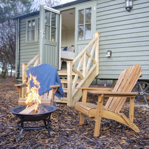 Toast marshmallows over the fire pit after a sunset barbecue