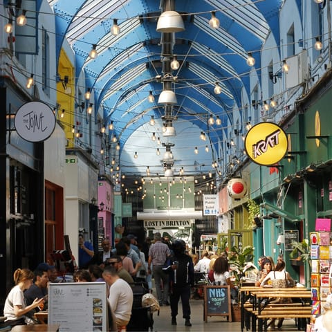 Stroll down to Brixton Market, a hub of lively eateries and stalls