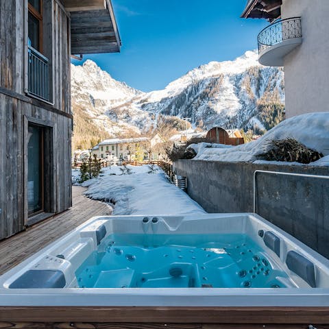 Unwind in the jacuzzi with gorgeous views of the Alps