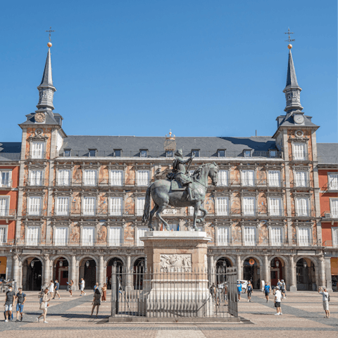 Stroll down to Madrid's bustling Plaza Mayor with its history and events