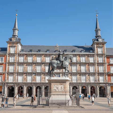 Stroll down to Madrid's bustling Plaza Mayor with its history and events