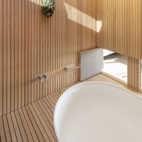 Relax and unwind in the luxurious sunken bath