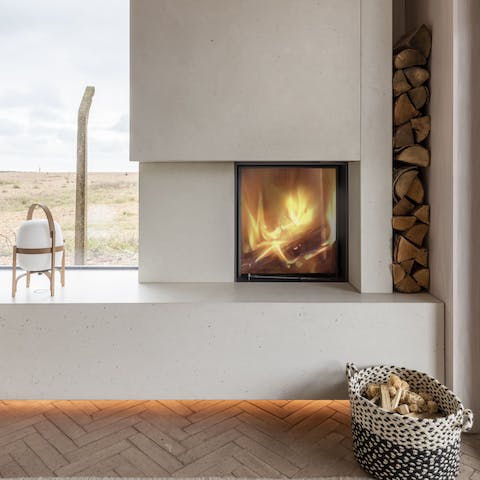 Get cosy by the wood burner and admire the views outside your window