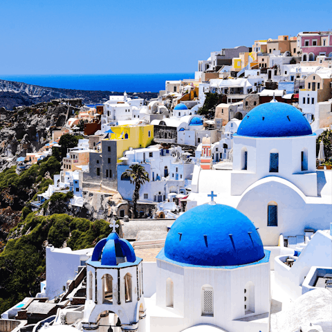 Explore the stunning island of Santorini, with it's gorgeous blue-domed buildings