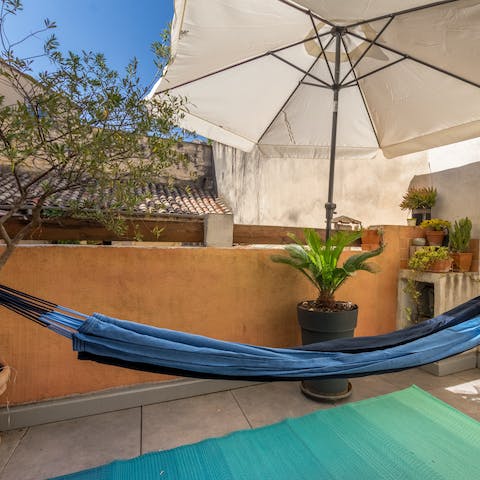 Unwind in the blue hammock on the private terrace