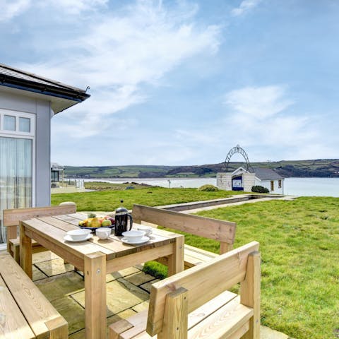 Set the table for a meal outside with the sea breeze in your hair