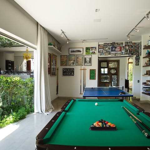 Slide open the glass doors and play a few games of pool or table tennis