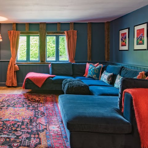 Get cosy with a good book in one of the colourful living rooms