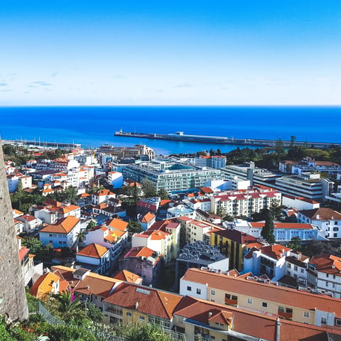 Explore the gorgeous gardens, idyllic harbour and Madeira wine cellars of Funchal