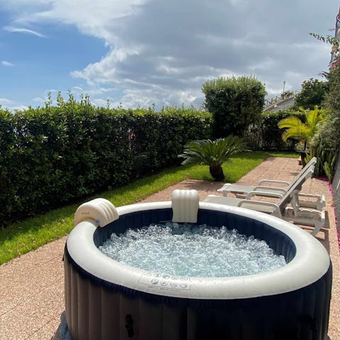 Enjoy a relaxing soak in the private hot tub or rest in the sunshine on a sun lounger