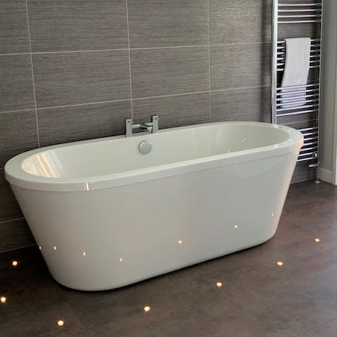 Take a long soak in the freestanding bathtub