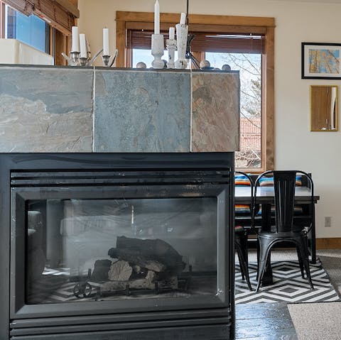 Warm up by the large electric fireplace in the living area