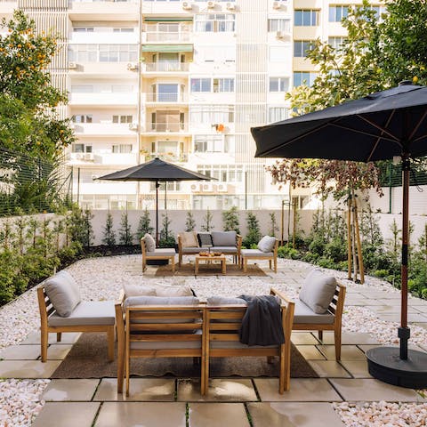 Enjoy a glass of Portuguese wine in the building's communal courtyard