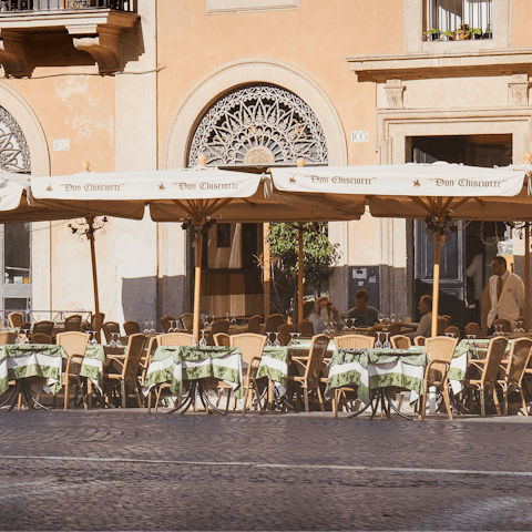 Savour the magic of Rome while sipping drinks in a restaurant 