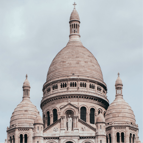 Stroll sixteen minutes to visit the beautiful Sacré-Cœur in Montmartre