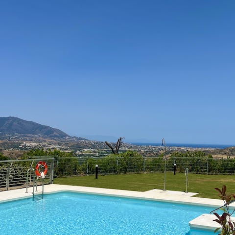 Swim in the communal pool as the sun warms your skin