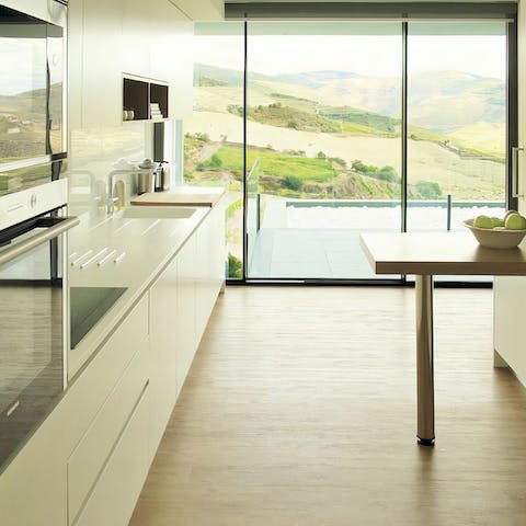 Whip up a culinary masterpiece in the fully-equipped kitchen as large windows bring the outside in