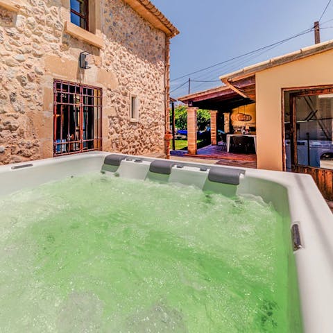 Relax in the hot tub with a glass of wine and plan how to spend your day