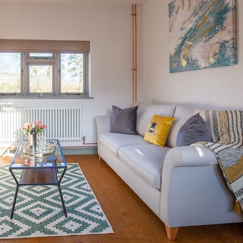 Come home to a bright and cosy living space after a long walk through the countryside