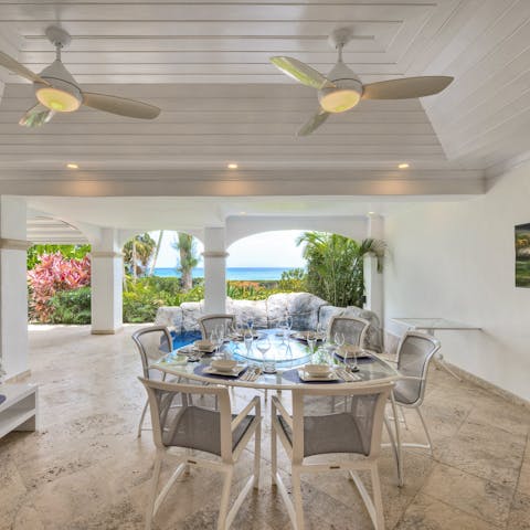 Gather around the outdoor dining table for alfresco barbecue feasts with a spectacular sea view