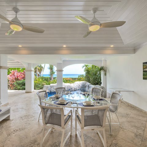 Gather around the outdoor dining table for alfresco barbecue feasts with a spectacular sea view