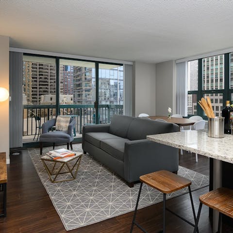 Relax and enjoy the views from the apartment’s floor-to-ceiling windows