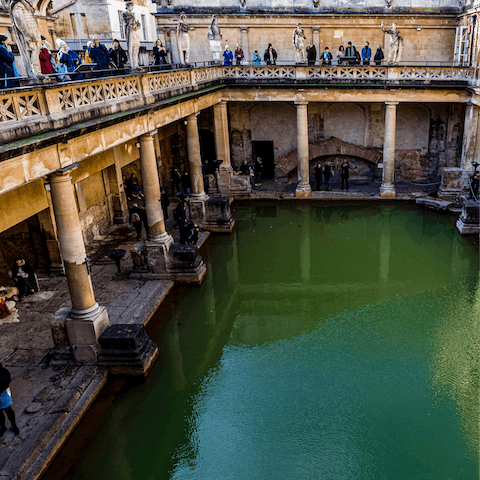 Visit the Roman Baths, a short stroll away