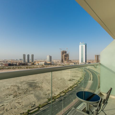 See the sparse skyline of the Arabian Desert from your private balcony
