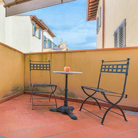 Enjoy alfresco aperitivo on the small balcony