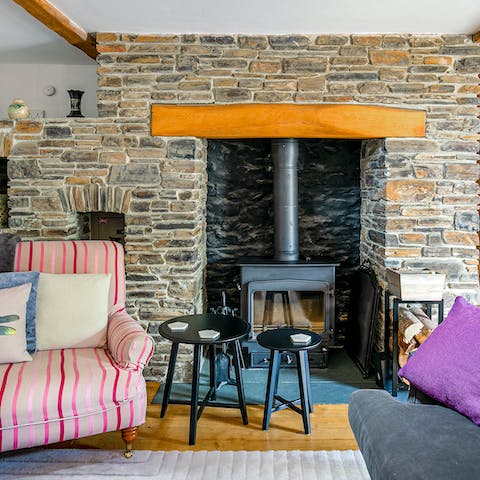 Light the wood-burning stove to keep the drawing room cosy-warm