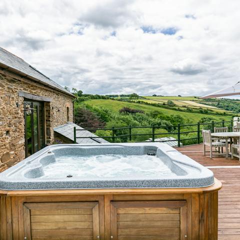 Take in the valley view from the warmth of the hot tub