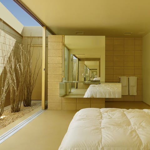 Sleep soundly in comfortable, stylish bedrooms – glass doors open to the atrium