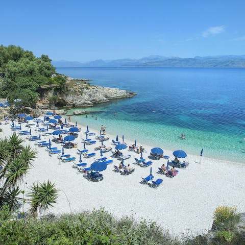 Spend sunny days under an umbrella at Avalaki Beach, minutes away