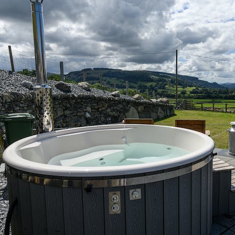 Gaze out at the rolling hills as you unwind in the private hot tub