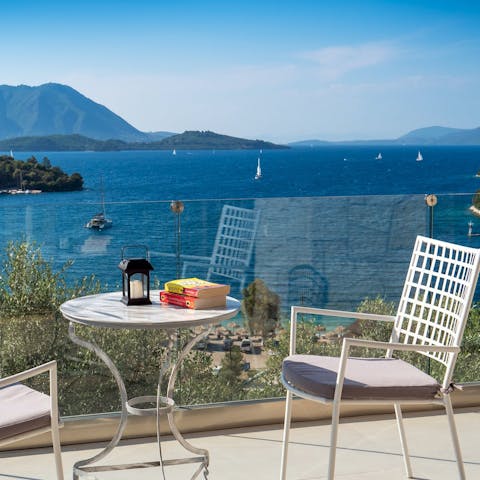 Sip a glass of ouzo on the private balcony and watch the boats sail by