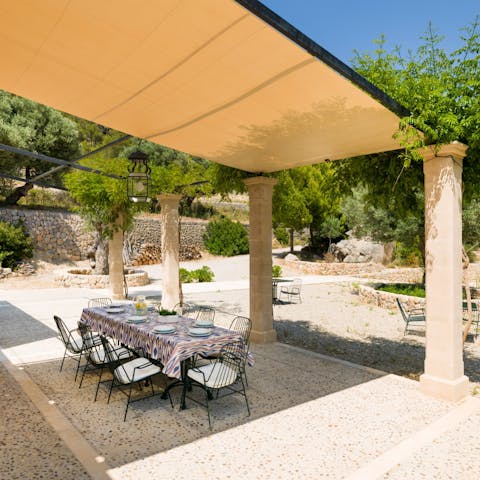 Drink and dine in the shade on the covered terrace area