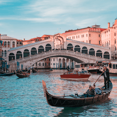 Stroll over (or sail under) the iconic Rialto Bridge, a landmark surrounded by beautiful buildings