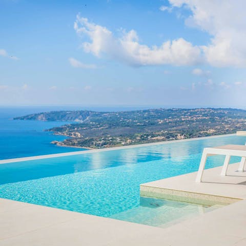 Gaze out at the headland from the infinity-edge swimming pool