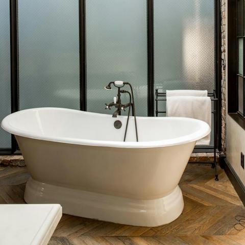 Run a hot bubble bath and soak your cares away in the freestanding tub