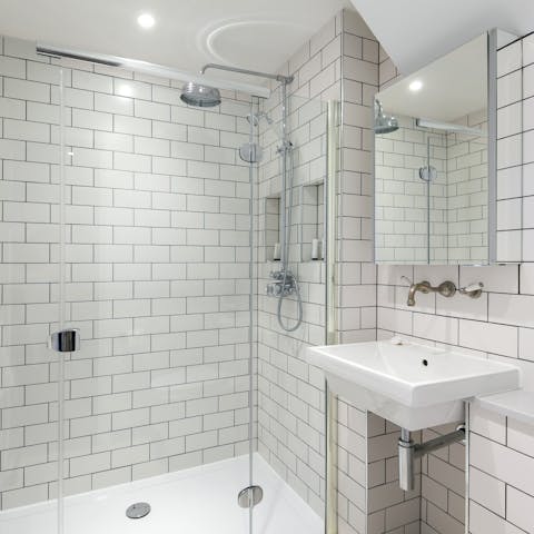 Pamper yourself in the sleek metro-tiled bathroom with its relaxing rainfall shower