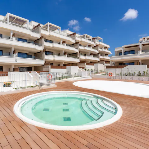 Relax in the shared Jacuzzi after a busy day exploring the coast