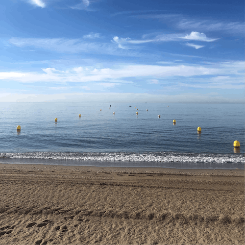 Stroll 500 metres to sink your feet into the sand at La Cala beach