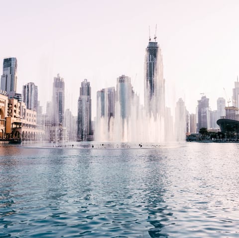 Walk to the Dubai Fountain, soaking up the spectacular show