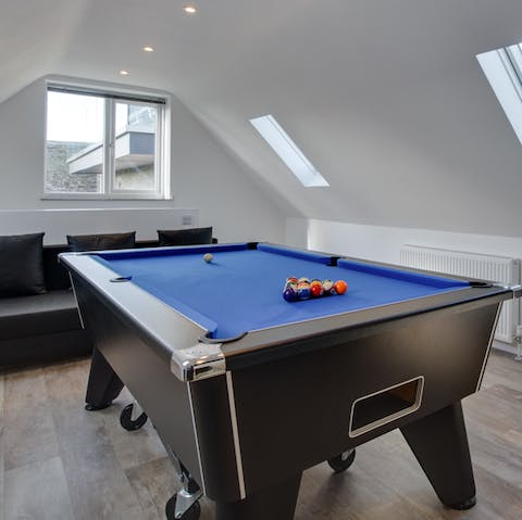 Challenge friends to a game of pool, or a video game on the Wii console, in the lively games room