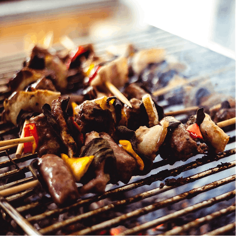 Make use of the shared grill area on the roof deck