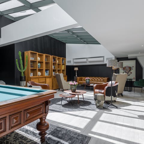 Play a game of billiards in the resplendent communal living area