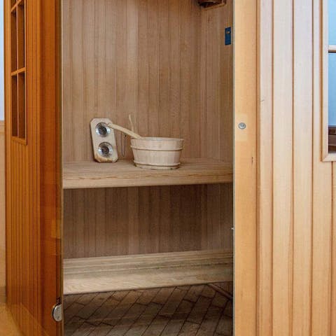 Let your worries steam away in the luxury of the wooden sauna 