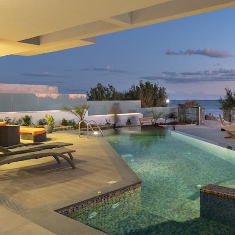 Swim a few lengths at sunset in your private infinity pool