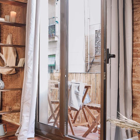 Step out onto the private balcony for a breath of fresh air
