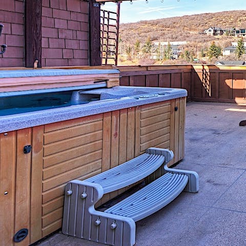 Chill out in the hot tub with views over the mountains
